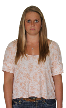 Person facing the camera against a plain background