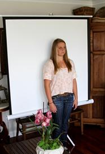 Portable backdrop set up for a passport photo at home